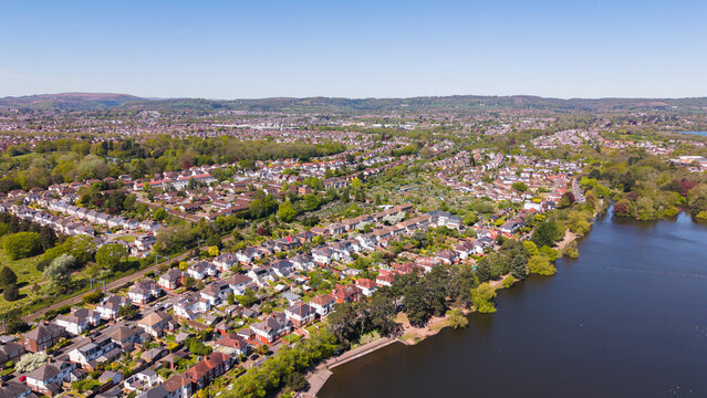 A high-angle aerial drone photo capturing the lush residential suburbs of Cardiff, situated west of Roath Park Lake.