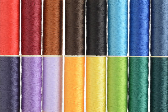 two rows of colorful sewing thread