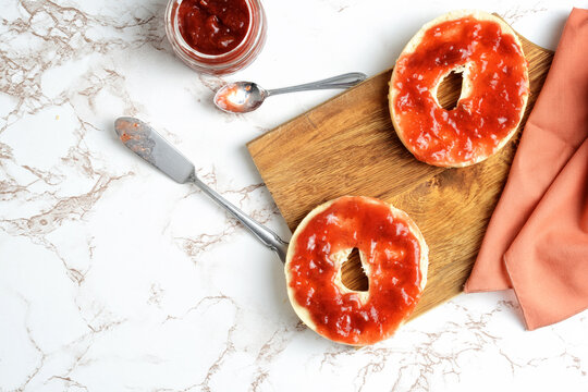 top view of bagel with strawberry rhubarb jam