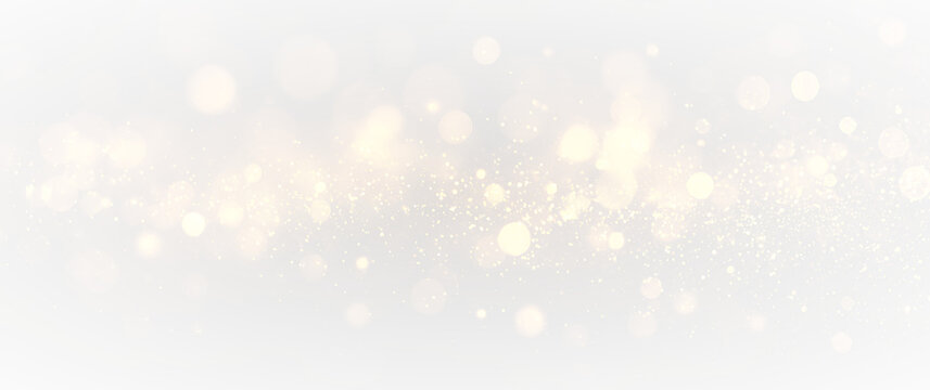 Vibrant golden glittering particles with glowing stardust and magical sparkle burst, festive luxury light effect isolated on transparent background for celebration visuals