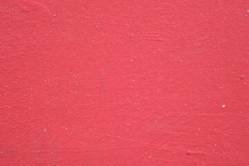 Fototapeta premium Vivid red painted concrete wall texture background