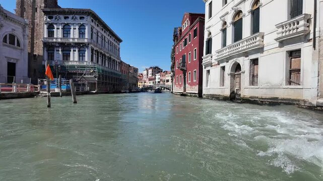 A view of the Canal Grande seen from one of the water busses that provide the public transport service for the city of Venice.