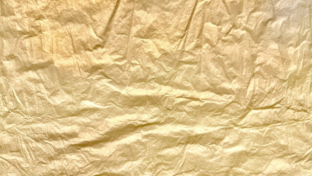 crinkled golden foil texture gleaming with subtle sheen abstract luxury background evoking opulence and vintage elegance