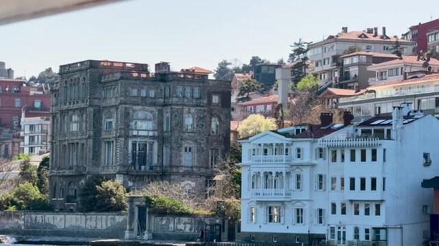 Exploring old buildings by the water in Istanbul during a clear day in spring