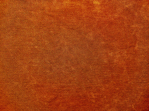 vibrant rusty orange denim texture closeup showcasing woven patterns subtle gradients and grunge details for abstract design backgrounds
