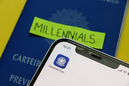 Salvador, Brazil - April 27, 2026: Brazilian Work Permit (CTPS) with a handwritten note saying "Millennials". The Millennial generation's impact on the labor market in Brazil concept. 