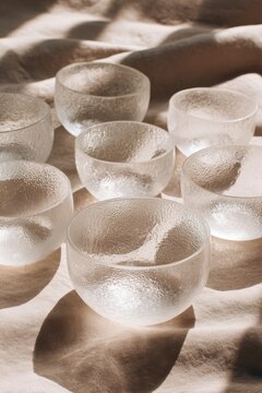 Minimalist zenithal arrangement of crystal meditation bowls with generous text area