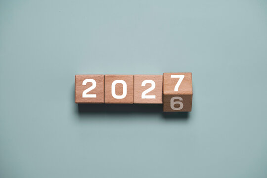 New year transition concept with wooden blocks changing from 2026 to 2027 for business planning, goal setting, future strategy, growth opportunities and fresh start for success in upcoming year