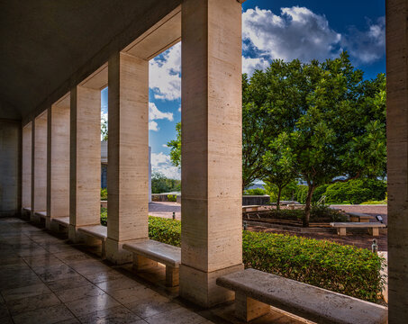 Rectangular Marble Columns with a Tree in Background.