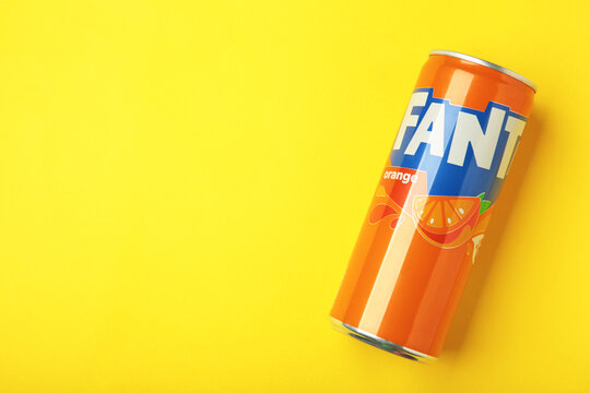 Mykolaiv, Ukraine - March 25, 2026. Aluminum can with sweet carbonated drink Fanta on yellow background. Popular beverage brand