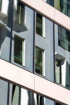 Minimal modern urban building exterior with clean facade windows and simple geometry pattern creating a calm architecture backdrop for design use