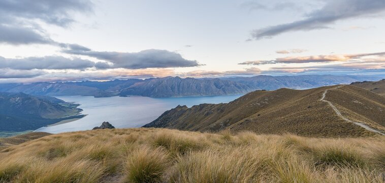 Sun shining, lake surrounded by mountains, Lake Hawea, view from Isthmus Peak, Otago, South Island, New Zealand