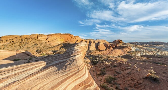 Fire Wave sandstone formation in evening light, behind Sleeping Lizard rock formation, Valley of Fire State Park, Nevada, USA