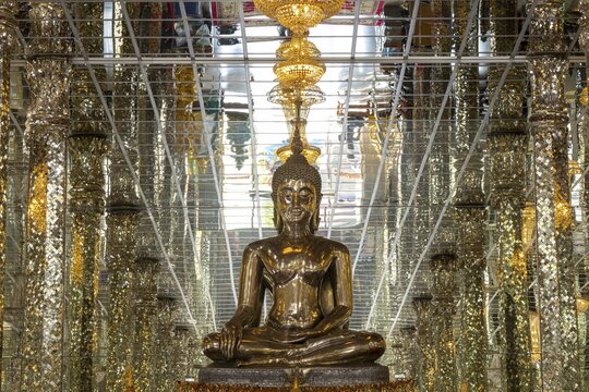 Silver Buddha statue, Bhumispara-mudra: Buddha Gautama at the moment of enlightenment, Wihan Kaeo (glass temple) : a breathtaking, mirrored ordination hall, Wat Muang, Ang Thong province, Isan, Thailand