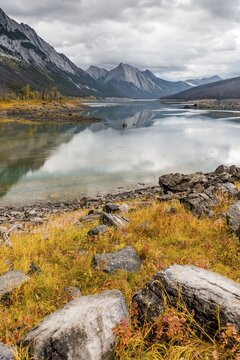 Mountains reflected in a lake, Medicine Lake, Maligne Valley, Jasper National Park, Alberta, Canada