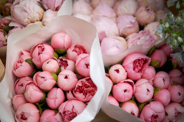 Stalls with flowers and bouquets at local street market © Irina Burakova