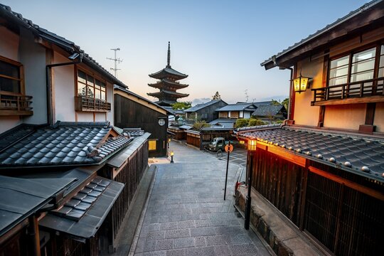Yasaka dori historic street in the old town with traditional Japanese houses, five-story Yasaka Pagoda of the Buddhist Hōkanji Temple at the back, evening mood, blue hour, Higashiyama, Kyoto, Japan