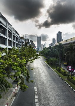 Empty street with skyscrapers behind, Bangkok, Thailand