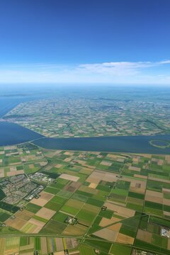 Agricultural landscape, fields from above, river flows into the North Sea, near Amsterdam, The Netherlands