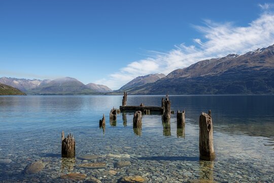 Decayed jetty, old wooden posts in Lake Wakatipu, near Glenorchy, Otago, South Island, New Zealand