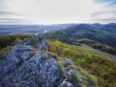 View from the Gisliflue of an autumnal forest with the Jura foothills behind, Talheim, Canton, Aargau, Switzerland