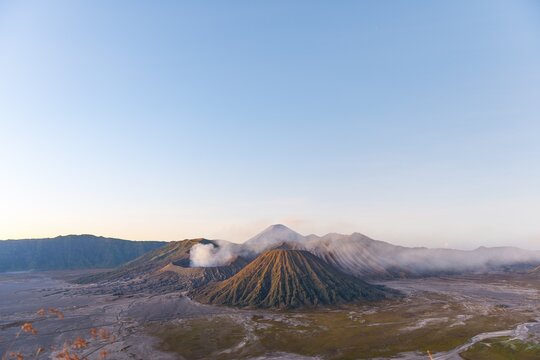 Sunrise, smoking Mount Bromo, Mt. Batok at front, Mt. Kursi at back, Mt. Gunung Semeru, morning atmosphere, Bromo Tengger Semeru National Park, Java, Indonesia
