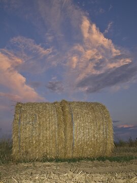 Bail of hay at sunset, St Veit, Lower Austria, Austria, Europe
