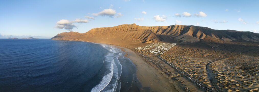 Panorama, Risco de Famara cliffs and sea with Famara beach, in the evening light, Playa de Famara, aerial view, Lanzarote, Canary Islands, Spain