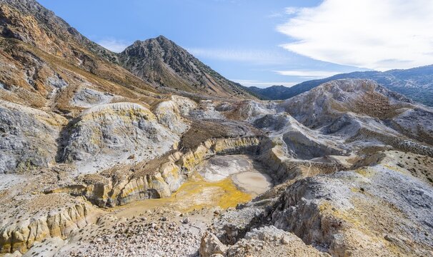 Crater with yellow discoloured sulphur stones and colourful mineral deposits, Caldera volcano with pumice fields, Alexandros crater, Nisyros, Dodecanese, Greece