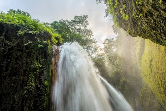 Waterfall in ravine, Air Terjun Belawan, Kalianyar, Sempol, Eastern Java, Indonesia