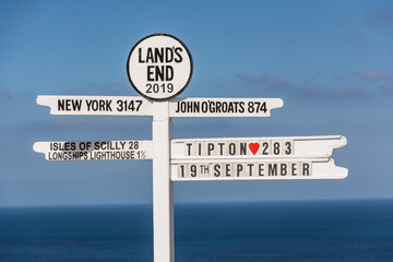 The Iconic Land's End Signpost with Distance Markers Overlooking the Atlantic Ocean  © Stephan