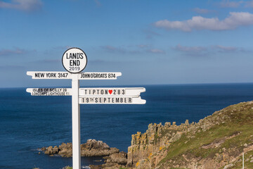 The Iconic Land's End Signpost with Distance Markers Overlooking the Atlantic Ocean  © Stephan