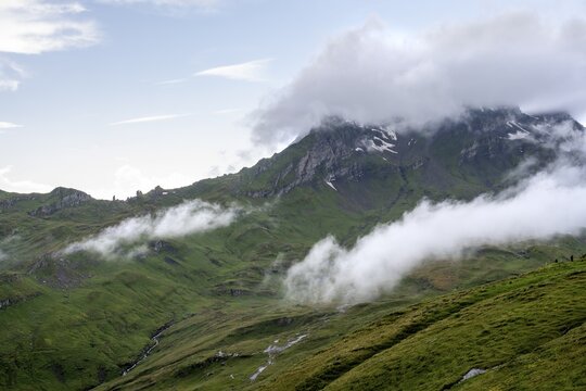 Clouds move around mountain peaks, Grindelwald First, Bernese Alps, Bernese Oberland, Switzerland