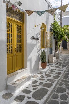 Cycladic house with yellow door, old town of Parikia, Paros, Cyclades, Greece