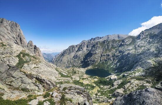 Mountain lake Lac de Melo, view from the Lac de Capitello, mountains in background, Restonica high valley, source of the Restonica River, Corte, Haute-Corse, Corsica, France