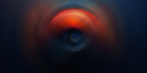 Abstract circular radial motion blur background with vibrant orange and dark blue tones creating artistic glowing concentric. © SmartVector Studio