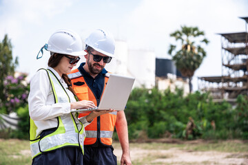 Refinery engineers planning project using tablet at industrial plant, reviewing workflow and operations in energy production environment © DJ Creative Studio