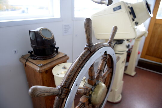 The steering wheel in the wheelhouse of the medium-sized fishing trawler CPT-129
