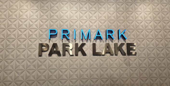 Primark Park Lake store sign featuring blue and silver 3D lettering on a white geometric textured wall. Picture taken on April 27, 2026 in Bucharest, Romania.