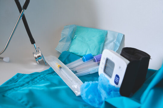 Medical instruments and scrubs displaying concepts of health, wellness, and preventative care