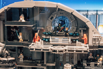 Naklejka premium 19 October 2025, Belgrade, Serbia: Detailed LEGO Star Wars Death Star toy model showing multiple interior scenes with minifigures on an exhibition stand