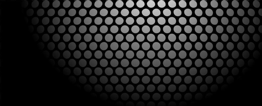 Abstract background of numerous dots in a gradient effect from dark to light, creating a textured pattern