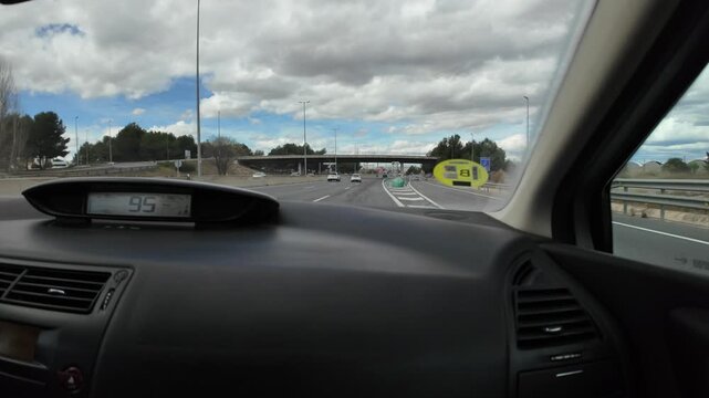 Mature man with goatee driving car on highway