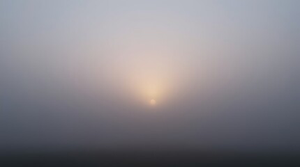 Fototapeta premium faint sun glowing through thick morning fog