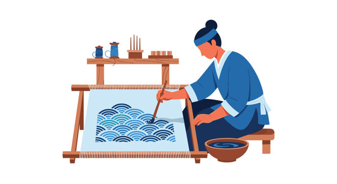 An artist in traditional attire sits beside a wooden dye bowl while meticulously painting intricate blue wave patterns onto a stretched white fabric canvas in a brightly lit studio