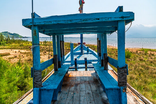 A view along a beached sampan over the Lap An Lagoon in Vietnam on a bright sunny day