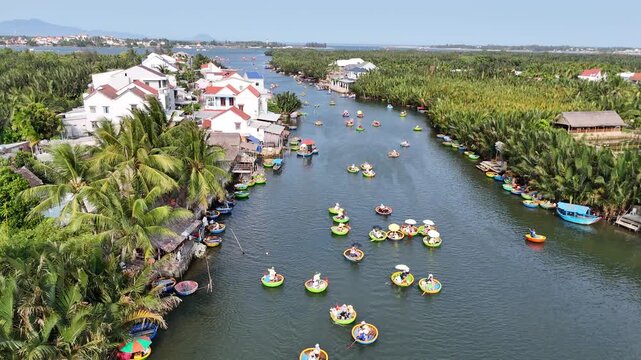 Aerial view of basket boats floating on river in Hoi An Vietnam tropical landscape