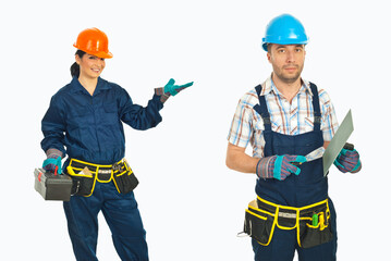 Fototapeta premium Two workers stand side by side, smiling at the camera