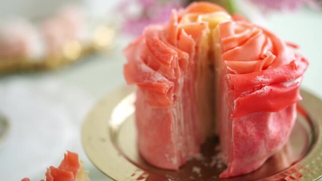 Layered crepe cake slice on a white plate, intricate rose-like design, perfect for dessert display, culinary art presentation, patisserie backdrop,  menu, recipe