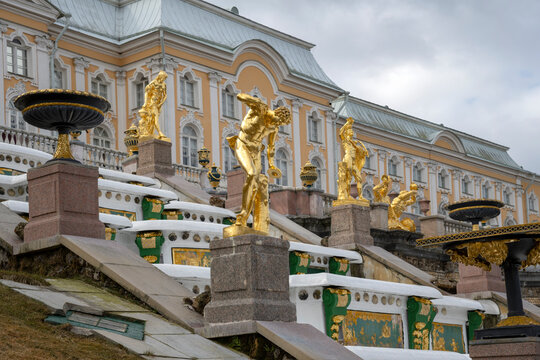 PETRODVORETS, RUSSIA - APRIL 18, 2026: View on the sculpture of the Grand Cascade on the background of the palace. Architectural ensemble of Peterhof Park